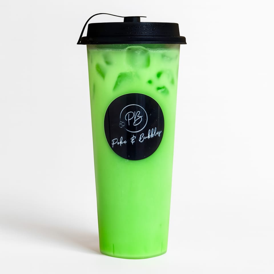 A vibrant green bubble tea with ice and a black lid, featuring the "Poke & Bubbles" logo.