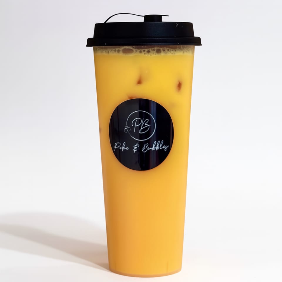A tall plastic cup of orange bubble tea with ice and a black lid, featuring the Poke & Bubbles logo.